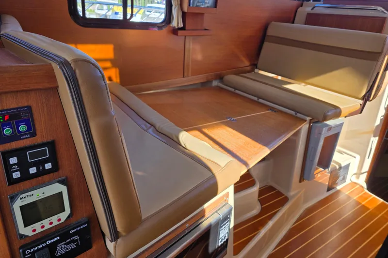Slide: The Image of Interior of 2020 Ranger Tugs R-31 CB with foldable seating and control panels. - 24
