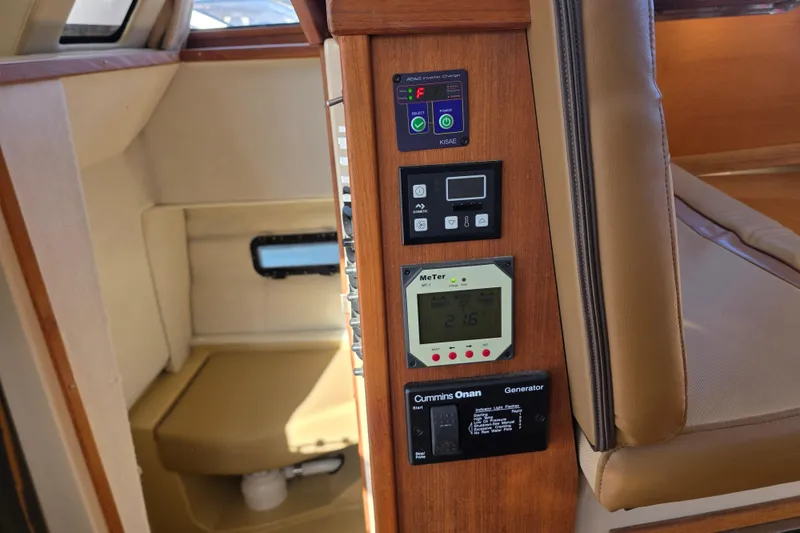 Slide: The Image of Control panel inside 2020 Ranger Tugs R-31 CB boat, featuring various electronic displays. - 28