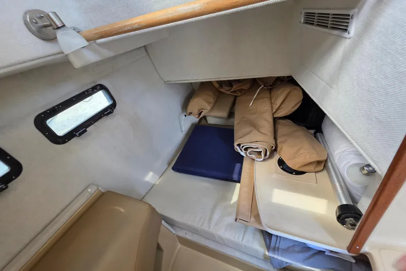 Slide: The Image of Interior cabin of 2020 Ranger Tugs R-31 CB with storage and rolled canvas. - 30