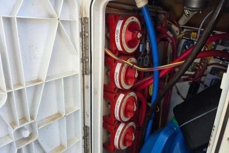 Slide: The Image of Electrical panel with red switches and wiring on a 2020 Ranger Tugs R-31 CB boat. - 41