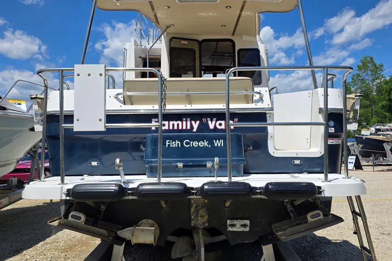 Slide: The Image of 2020 Ranger Tugs R-31 CB boat docked, rear view, Fish Creek, WI. - 5