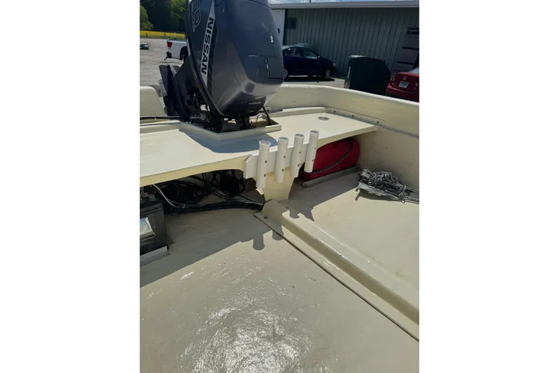 Slide: The Image of 1998 Carolina Skiff Semi-Vee 19 with Nissan outboard motor and rod holders. - 10