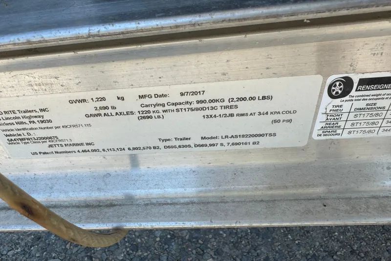 Slide: The Image of Label on trailer showing specifications and tire details for Carolina Skiff Semi-Vee 19, 1998. - 13