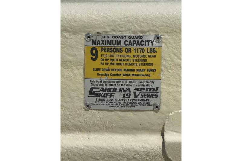 Slide: The Image of 1998 Carolina Skiff Semi-Vee 19 capacity plate, maximum 9 persons or 1170 lbs. - 14
