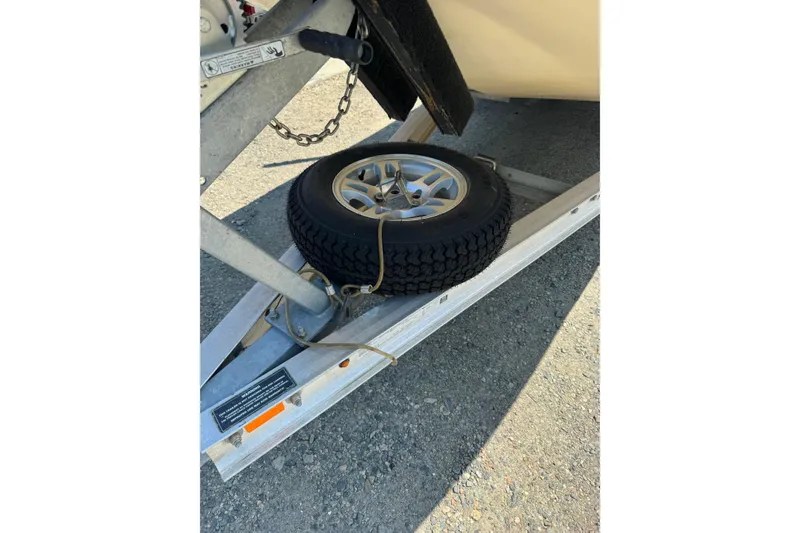 Slide: The Image of Trailer with spare tire for 1998 Carolina Skiff Semi-Vee 19 boat. - 3