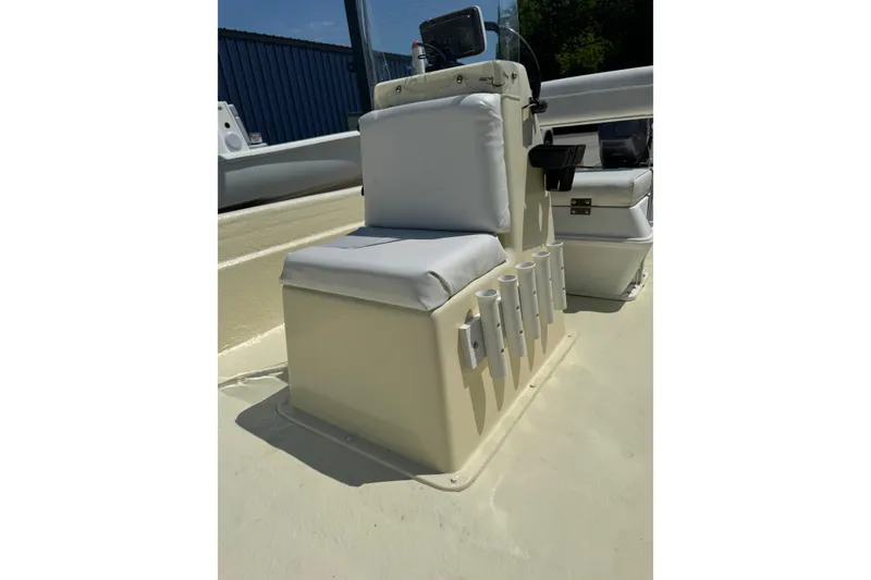 Slide: The Image of 1998 Carolina Skiff Semi-Vee 19 boat seat with rod holders and console. - 6