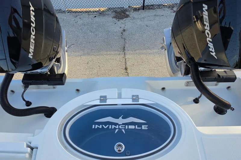 Slide: The Image of 2026 Invincible 33 Catamaran with dual Mercury engines, rear view. - 10