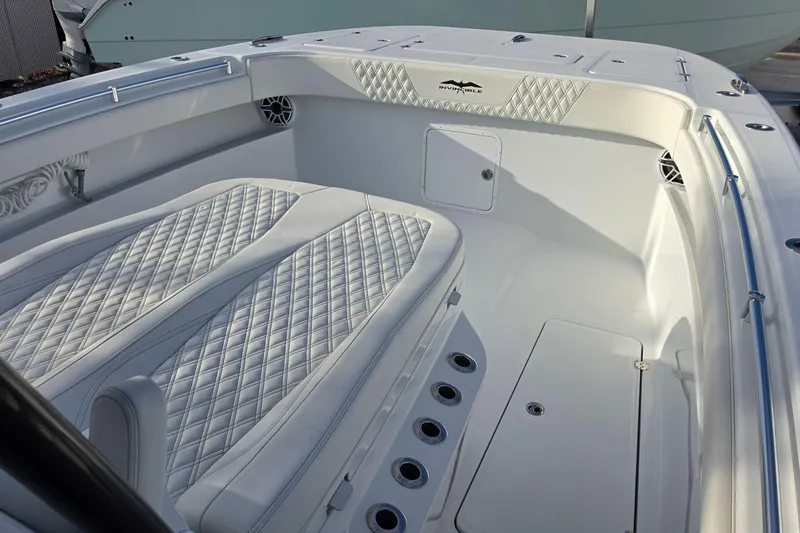 Slide: The Image of Luxurious interior of 2026 Invincible 33 Catamaran with quilted seating and sleek design. - 23