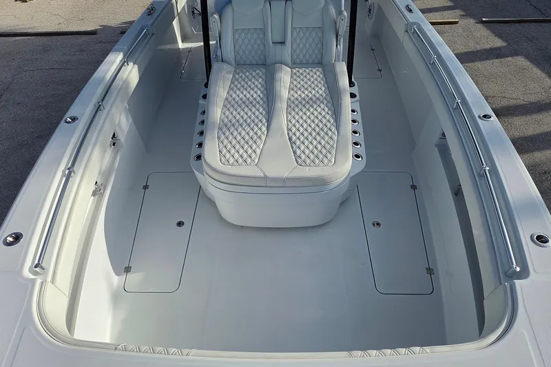 Slide: The Image of 2026 Invincible 33 Catamaran interior with sleek seating and spacious deck design. - 24