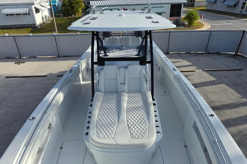 Slide: The Image of 2026 Invincible 33 Catamaran with sleek design and luxurious seating on display. - 25