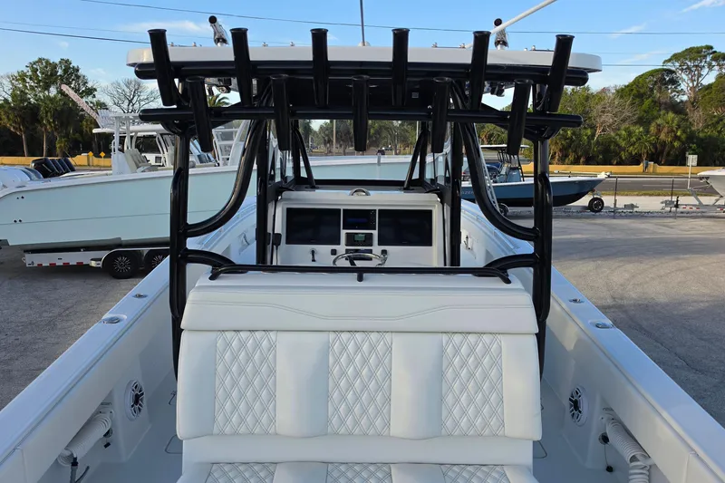 Slide: The Image of 2026 Invincible 33 Catamaran interior with white seating and black framework. - 9