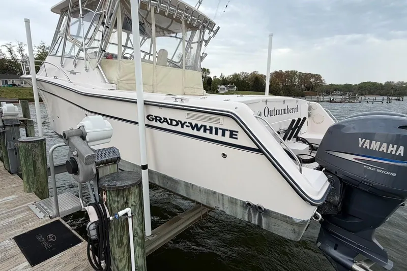 The Image of 2007 Grady-White Express 330 boat docked with Yamaha outboard motor. - 0