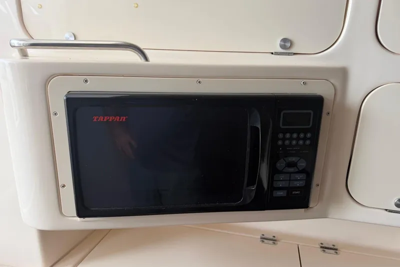 Slide: The Image of Built-in Tappan microwave in 2007 Grady-White Express 330 boat kitchen area. - 10