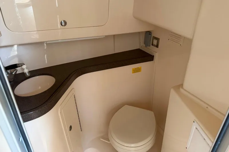 Slide: The Image of 2007 Grady-White Express 330 boat bathroom with sink and toilet. - 13