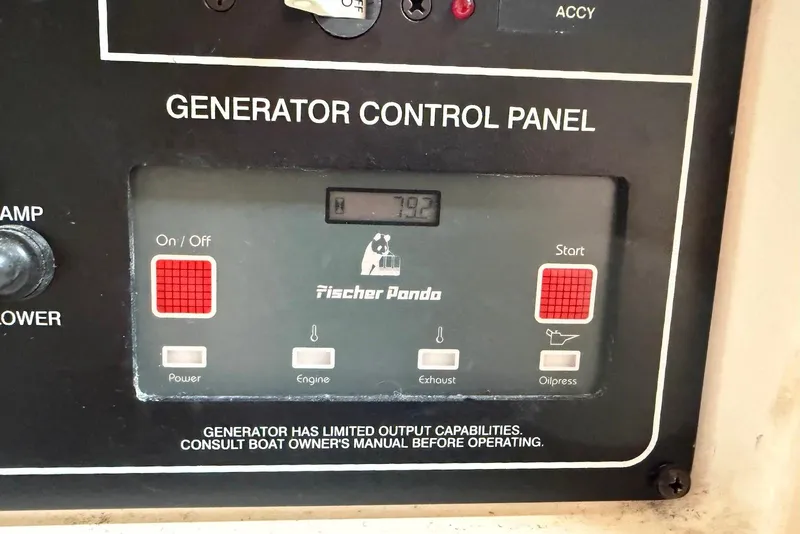 Slide: The Image of Generator control panel on a 2007 Grady-White Express 330 boat, featuring Fischer Panda controls. - 17