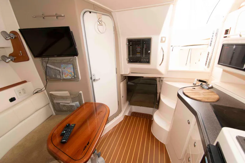 Slide: The Image of Interior of 2007 Grady-White Express 330 boat with wood accents and modern amenities. - 21