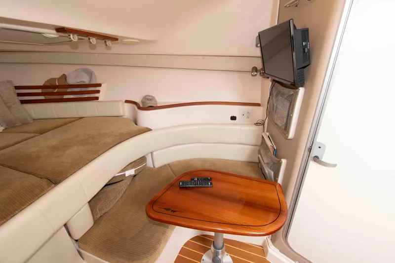 Slide: The Image of Interior of 2007 Grady-White Express 330 boat with cozy seating and mounted TV. - 22