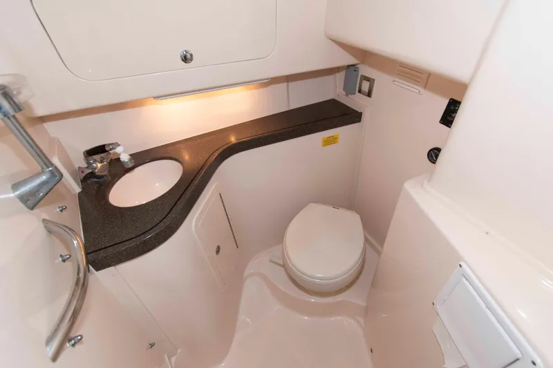 Slide: The Image of 2007 Grady-White Express 330 boat bathroom with sink and toilet. - 24