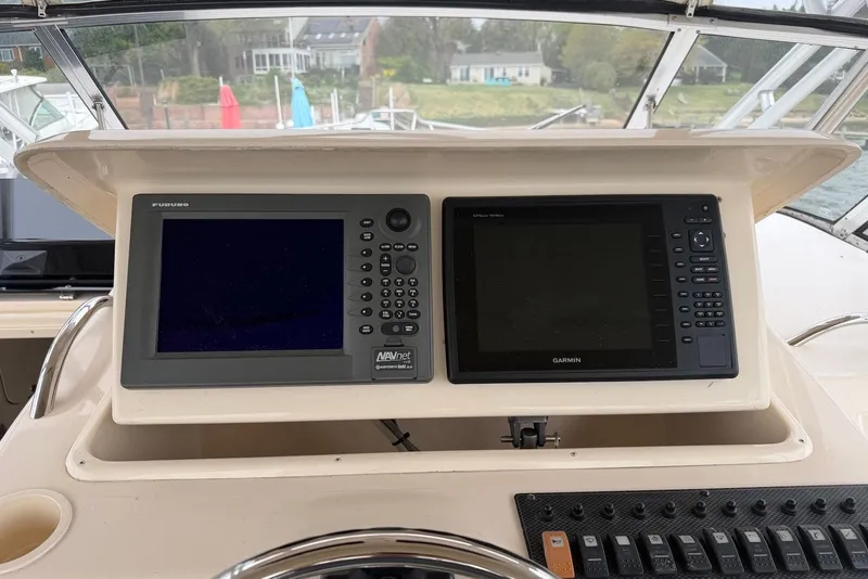 Slide: The Image of 2007 Grady-White Express 330 helm with Furuno and Garmin navigation displays. - 7