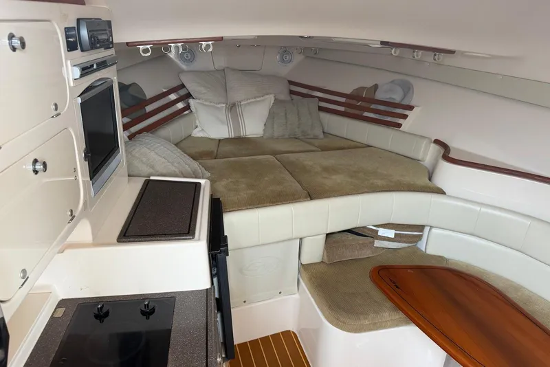 Slide: The Image of Interior of 2007 Grady-White Express 330 boat with cozy cabin and kitchenette. - 8