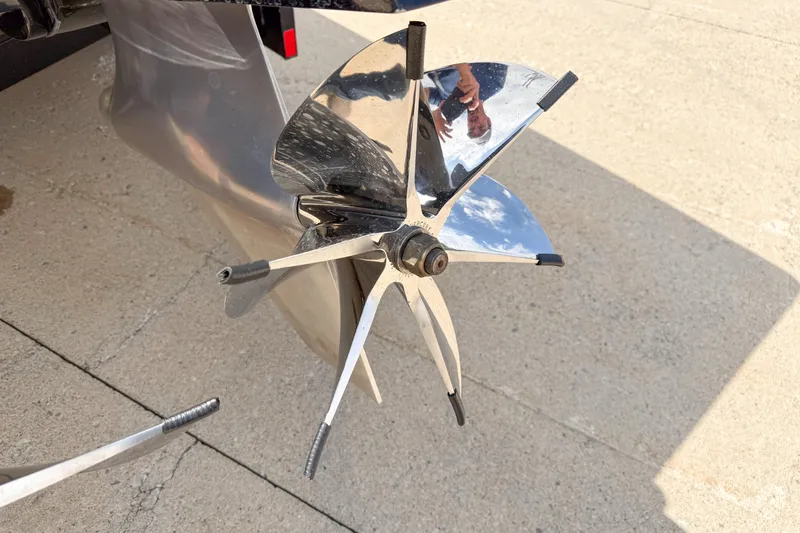 Slide: The Image of Close-up of a 2007 Fountain 42 Lightning boat propeller on a concrete surface. - 16