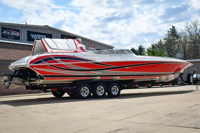 Slide: The Image of 2007 Fountain 42 Lightning speedboat with red and silver design on a trailer. - 2