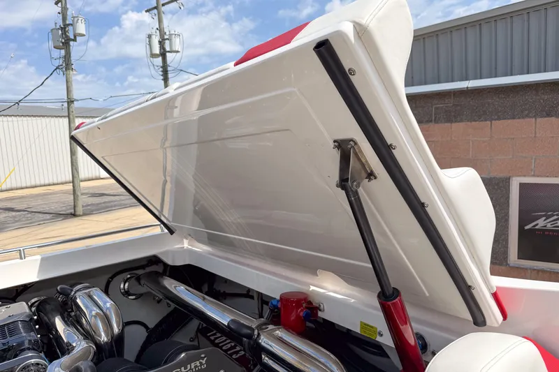 Slide: The Image of Open engine compartment of 2007 Fountain 42 Lightning boat, showcasing mechanical components. - 29