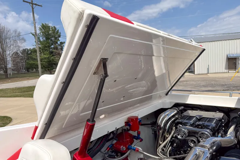 Slide: The Image of 2007 Fountain 42 Lightning boat engine compartment with open hatch, showcasing powerful engine components. - 30