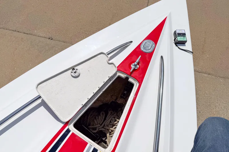 Slide: The Image of Open storage compartment on 2007 Fountain 42 Lightning boat deck with red accents. - 34