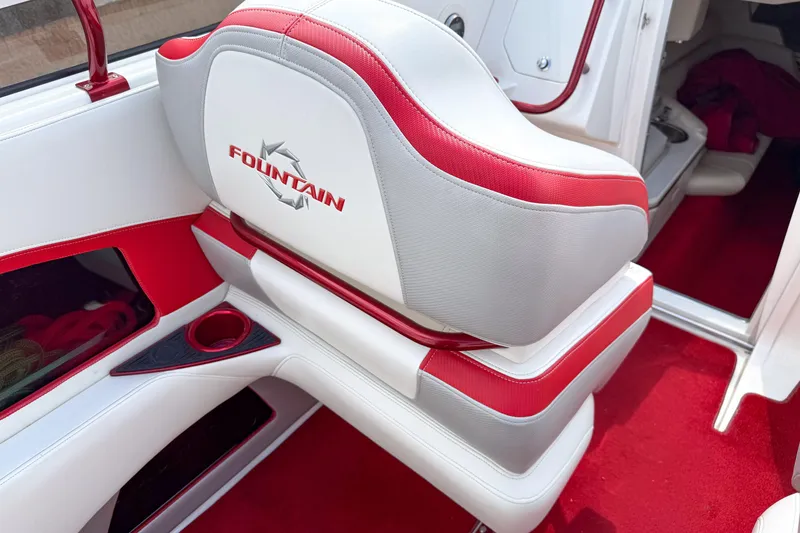 Slide: The Image of Red and white interior of a 2007 Fountain 42 Lightning boat, featuring branded seating. - 46