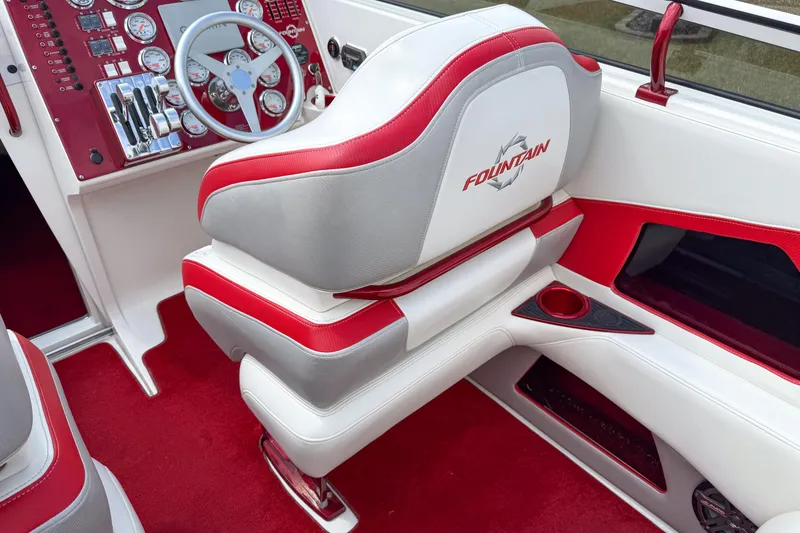 Slide: The Image of Interior of a 2007 Fountain 42 Lightning boat with red and white seating. - 47