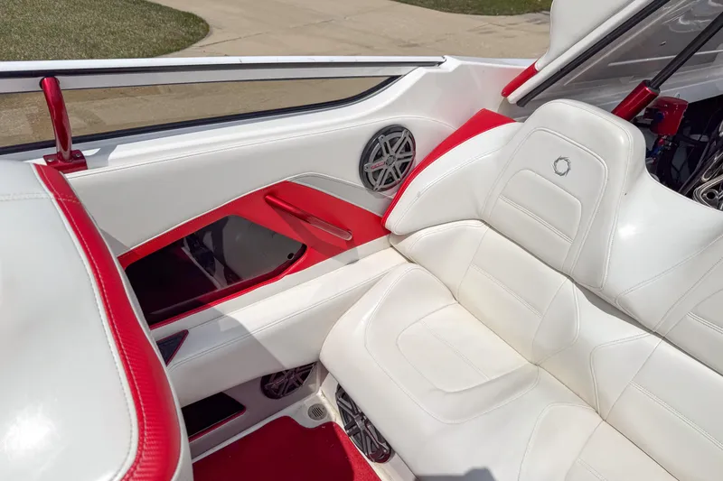 Slide: The Image of 2007 Fountain 42 Lightning boat interior with white and red seating and speaker system. - 50