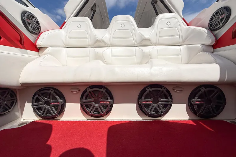 Slide: The Image of Interior of 2007 Fountain 42 Lightning boat with white seats and multiple speakers. - 51