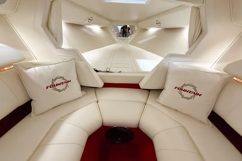 Slide: The Image of Luxurious interior of a 2007 Fountain 42 Lightning boat with plush seating and branded cushions. - 67