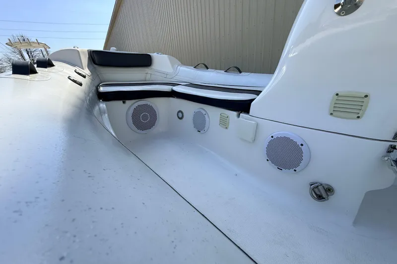 Slide: The Image of 2015 Walker Bay 450 Generation boat interior with seating and speakers. - 8