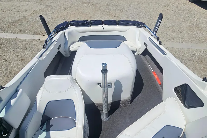 Slide: The Image of 2000 Centurion Sport Bowrider interior with white seating and gray accents. - 11