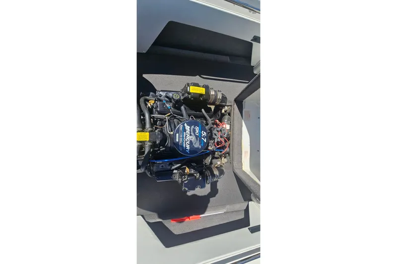 Slide: The Image of Engine compartment of a 2000 Centurion Sport Bowrider with a Mercury 5.7L engine. - 13