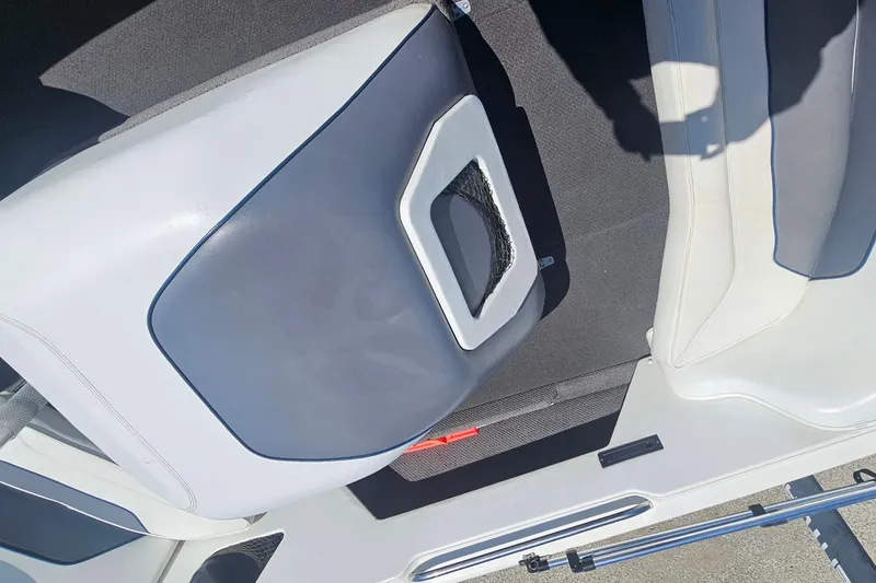 Slide: The Image of Centurion Sport Bowrider 2000 interior seating with gray and white upholstery. - 15