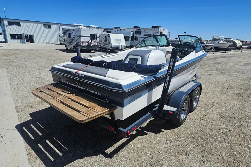 Slide: The Image of 2000 Centurion Sport Bowrider boat on trailer in outdoor storage area. - 5