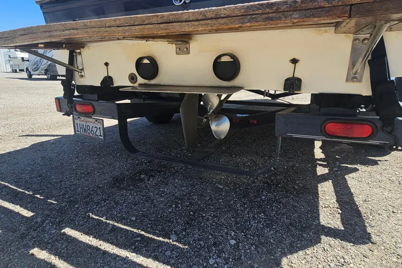 Slide: The Image of Rear view of a 2000 Centurion Sport Bowrider boat on a trailer. - 6