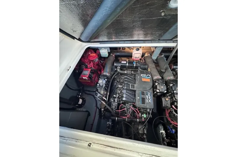 Slide: The Image of Engine compartment of a 1998 Sea Ray Sundancer 330 boat, showcasing mechanical components. - 17