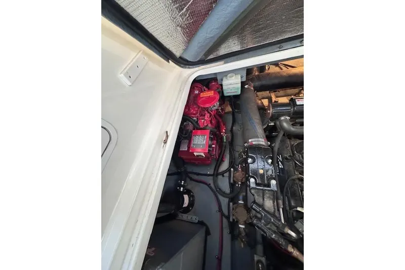Slide: The Image of Engine compartment of a 1998 Sea Ray Sundancer 330 boat, showing mechanical components. - 18