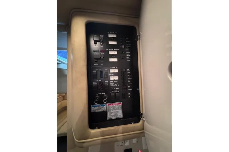 Slide: The Image of Electrical panel inside a 1998 Sea Ray Sundancer 330 yacht cabin. - 21