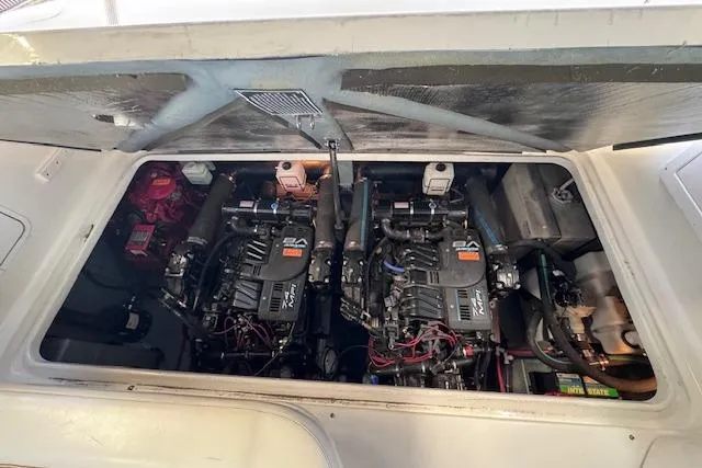 Slide: The Image of Engine compartment of a 1998 Sea Ray Sundancer 330 with twin engines visible. - 31