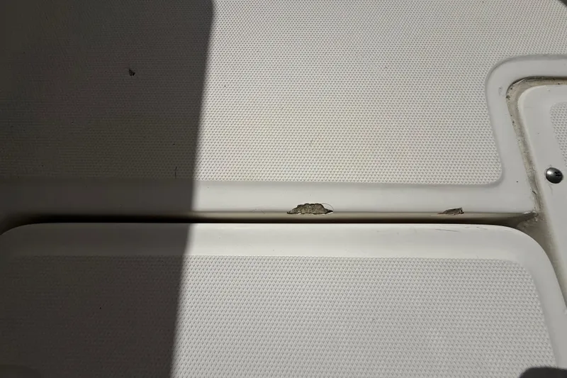 Slide: The Image of Damaged deck surface on 2007 Boston Whaler 270 Outrage boat. - 102