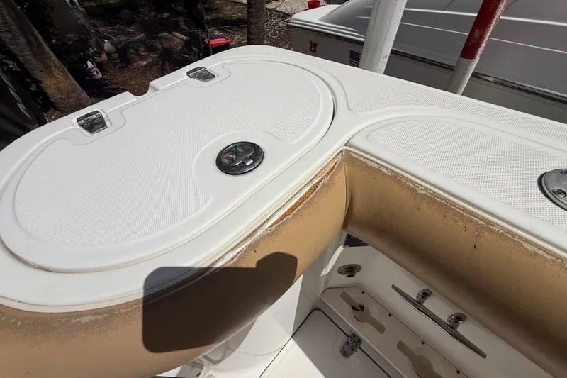 Slide: The Image of 2007 Boston Whaler 270 Outrage boat interior detail with storage compartments and seating. - 103