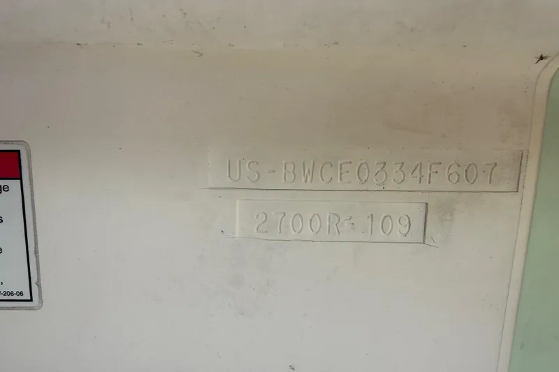 Slide: The Image of Hull identification number on a 2007 Boston Whaler 270 Outrage boat. - 104
