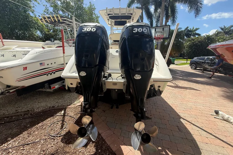 Slide: The Image of 2007 Boston Whaler 270 Outrage with twin 300 horsepower engines, parked outdoors. - 26