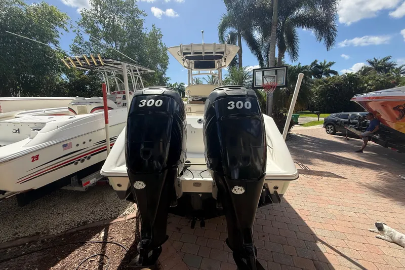 Slide: The Image of 2007 Boston Whaler 270 Outrage with twin 300 horsepower engines, parked outdoors. - 27