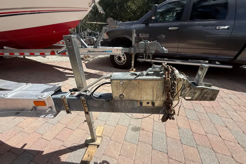 Slide: The Image of Trailer hitch of a 2007 Boston Whaler 270 Outrage, parked on brick pavement. - 33